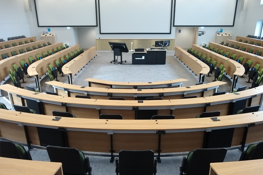 A lecture theatre with curved desks