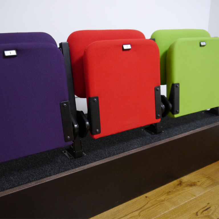 Introducing Optima – retractable seating for every space and budget.